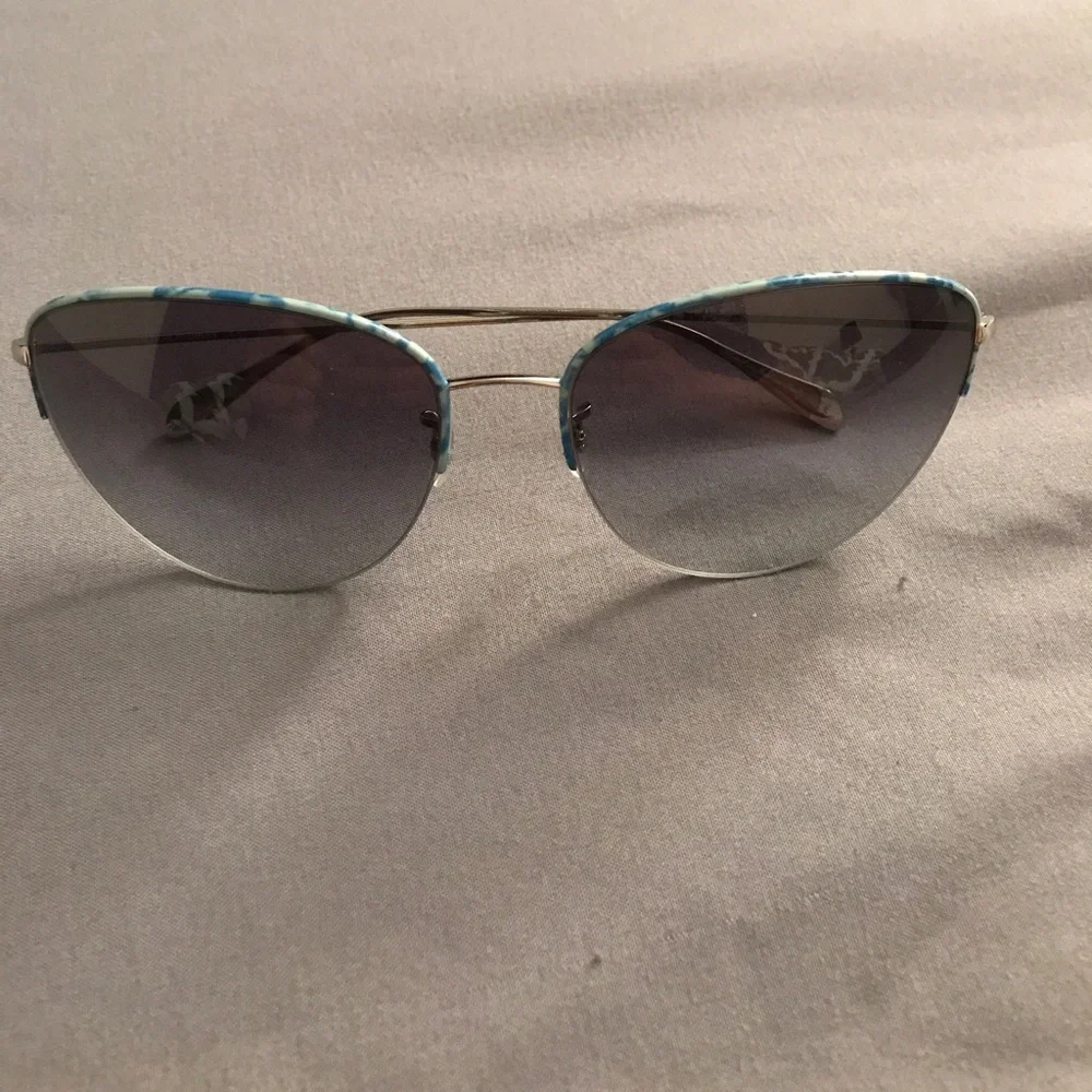 Oliver Peoples Silver Aviator Sunglasses with Blue Trim